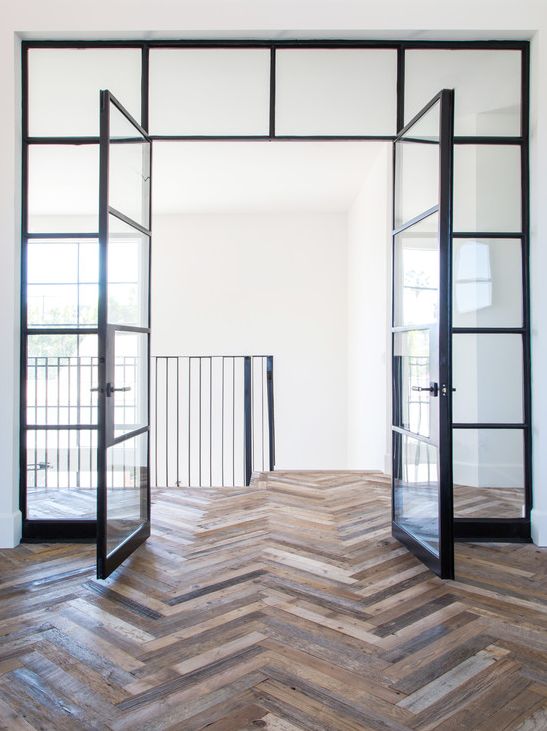 White walls, black framed glass and that floor!